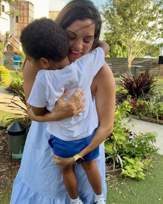 Jamie hugging her nephew outdoors