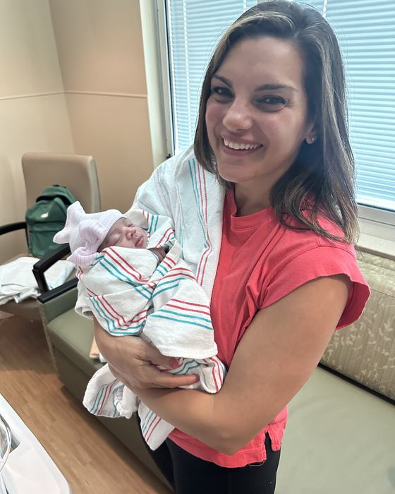 Jamie holding her newborn niece